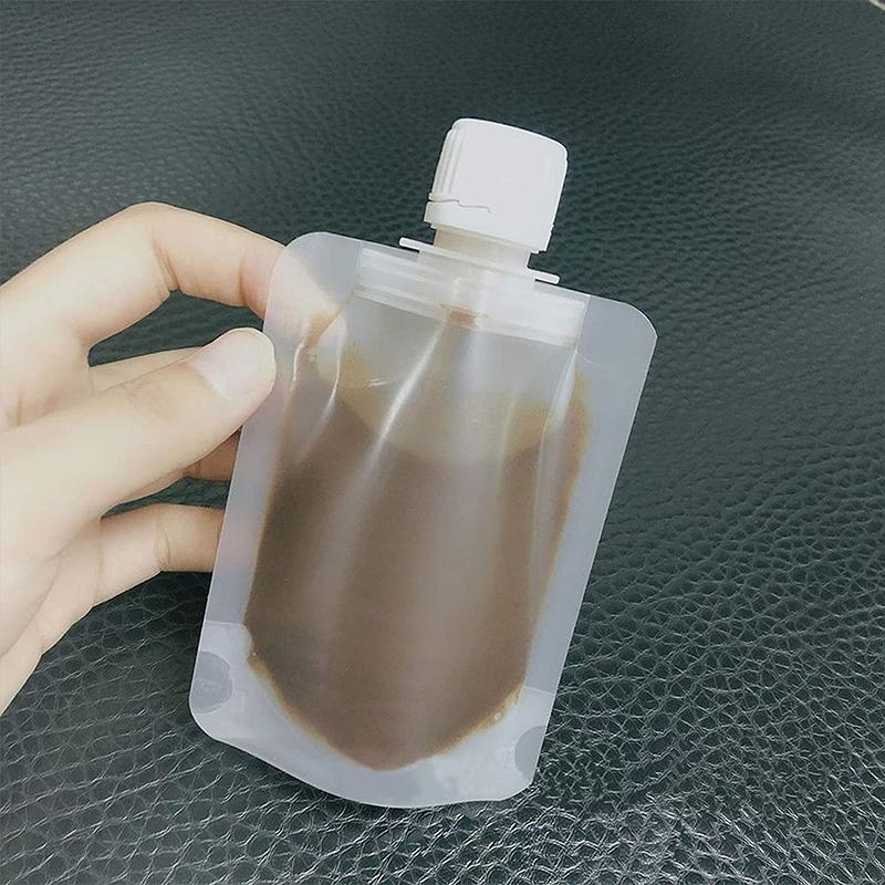 Gennemsigtig 100 ml pose til kosmetik, tæt skruelåg, genopfyldelig, praktisk design.