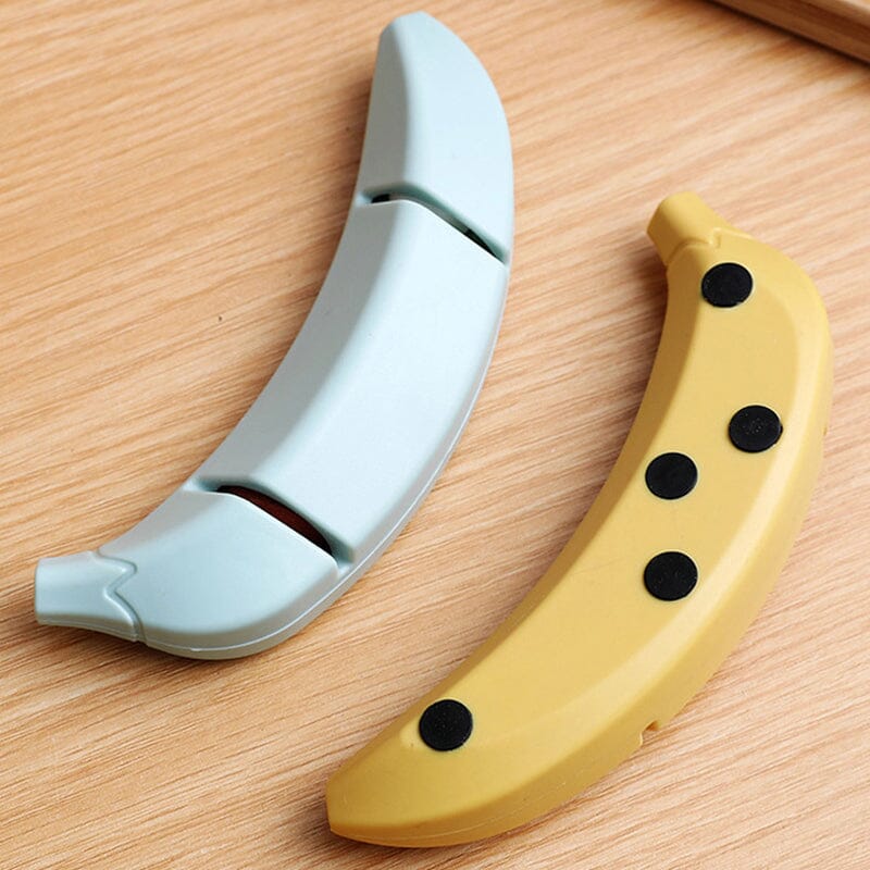 Kreativ knivsliber med banan-design, gul farve, kompakt størrelse, et sjovt og praktisk tilbehør til køkkenet.
