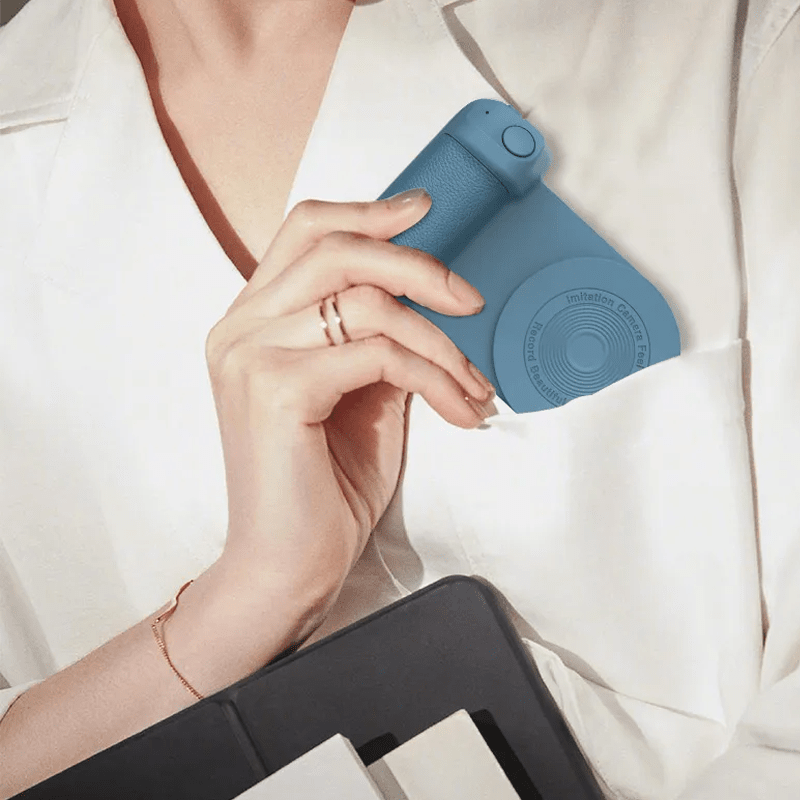 Magneettinen Bluetooth-kamerakahva puhelimille, ergonominen muotoilu, liukumaton pinta, musta väri, innovatiivinen kiinnitys.