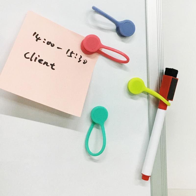 Magneettiset kaapelisiteet: värikkäät silikonipidikkeet, minimalistinen muotoilu, vahva magneettikiinnitys.