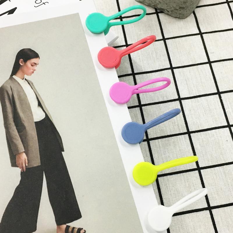 Magneettiset kaapelisiteet: värikkäät silikonipidikkeet, minimalistinen muotoilu, vahva magneettikiinnitys.