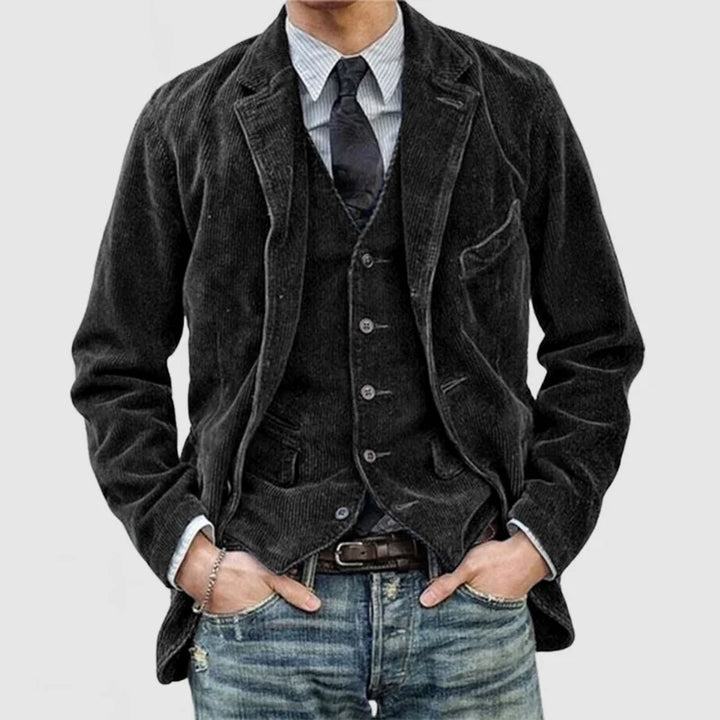 Herre cordjakke i sort eller brun, stilfuldt design, tidløst og behageligt look, fremhæver detaljer.