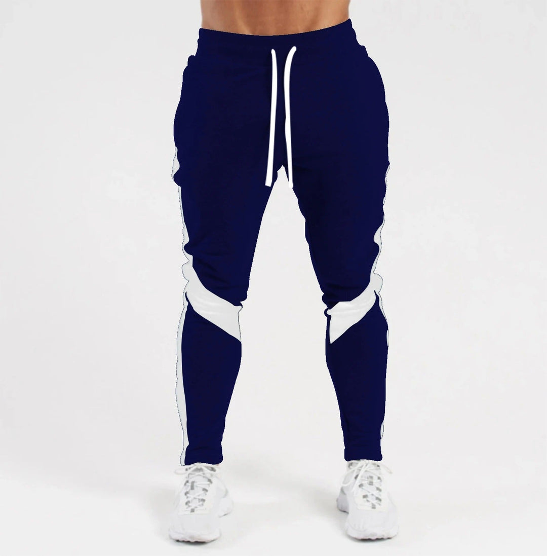 "Miesten hengittävät fitness joggersit, joustava istuvuus, harmaa väri, taskut, kiristysnauha vyötäröllä, moderni design."