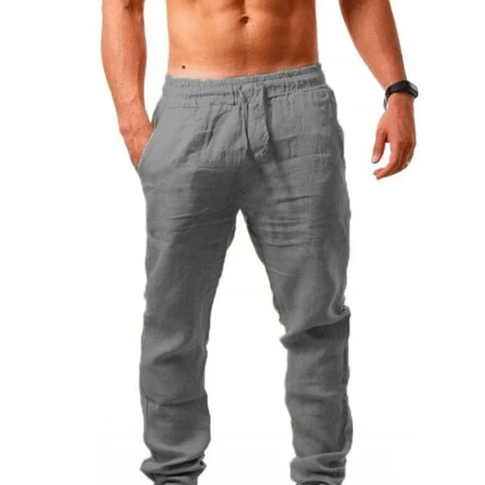 Miesten hengittävät slim-fit kuntohousut, harmaa väri, joustava vyötärö, sopii treeniin ja vapaa-aikaan.