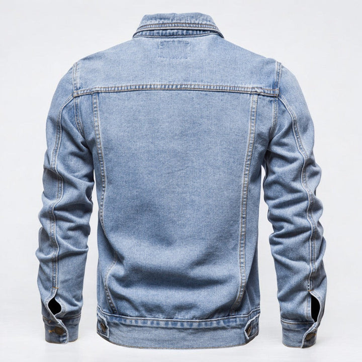 Miesten kestävä pesemätön denim takki edestä, jykevä sininen materiaali, rintataskut, sopii moderniin tyyliin.