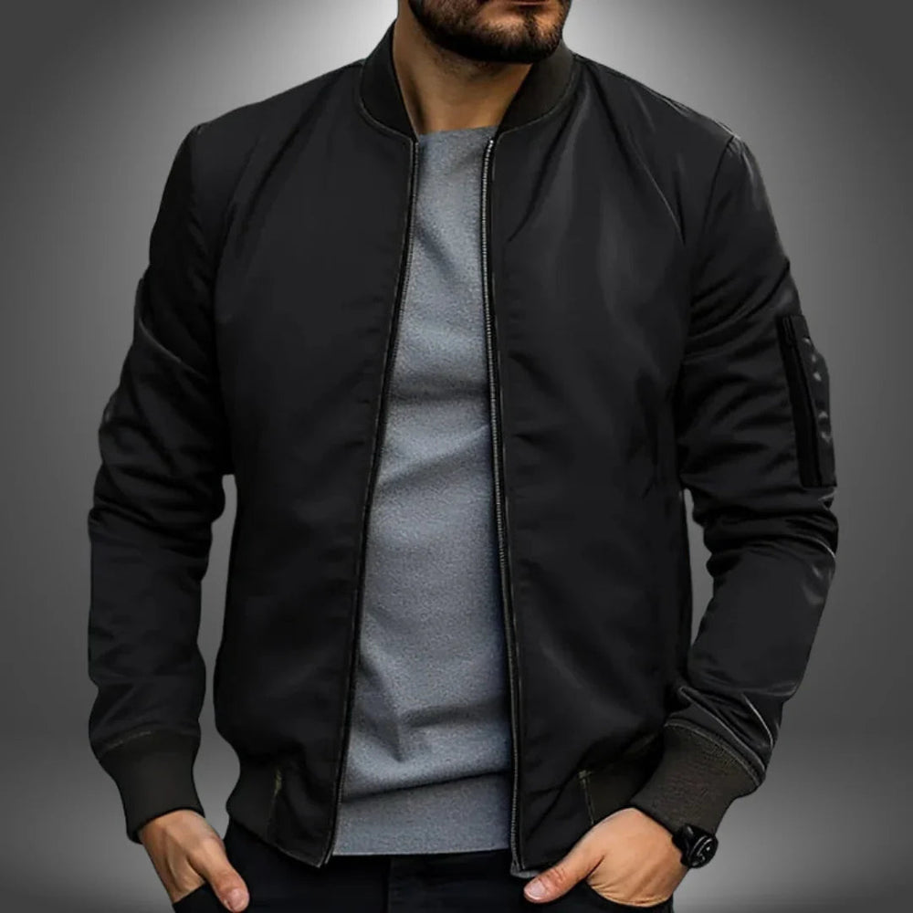 "Miesten kevyt tuulitakkityylinen bomber-takki, minimalistinen design, ribbaus hihansuissa, vetoketjullinen tasku"