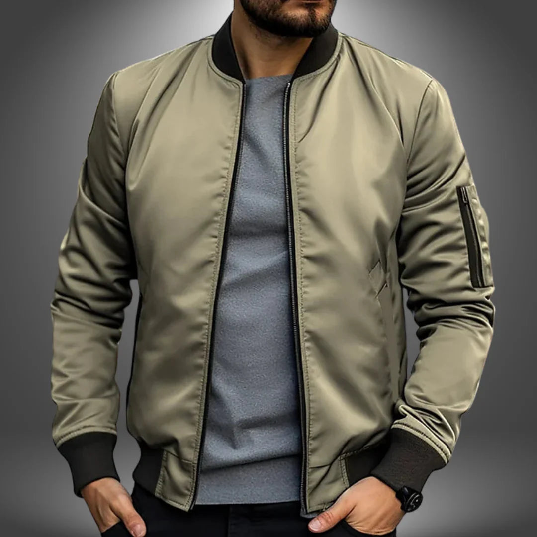 "Miesten kevyt tuulitakkityylinen bomber-takki, minimalistinen design, ribbaus hihansuissa, vetoketjullinen tasku"
