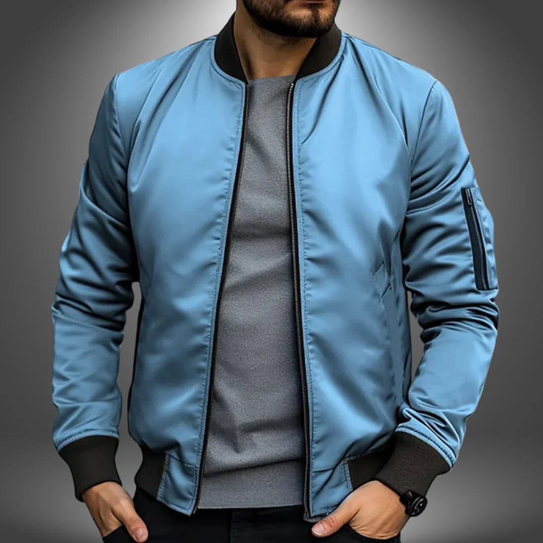 "Miesten kevyt tuulitakkityylinen bomber-takki, minimalistinen design, ribbaus hihansuissa, vetoketjullinen tasku"