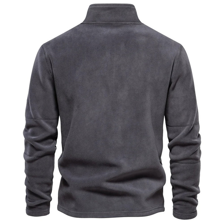 Miesten lämmin fleece soft shell -takki, hengittävä, moderni muotoilu, vetoketjullinen kaulus, tummansininen sävy.