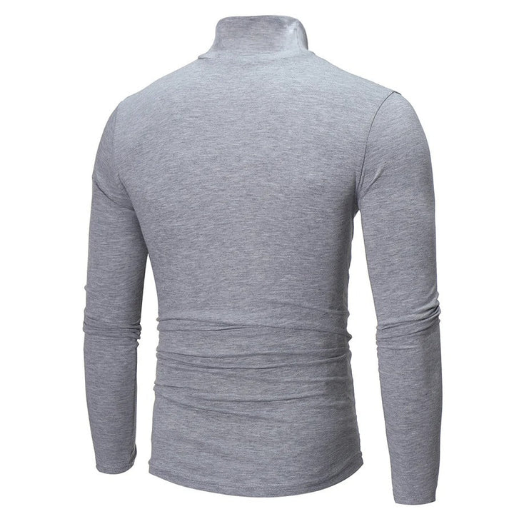 "Miesten musta slim-fit korkeakauluksinen lämpöpaita, pitkähihaiset, moderni malli talvivalikoimaan."