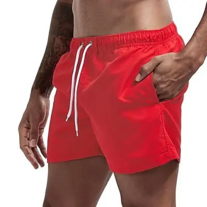 "Miesten nopeasti kuivuvat uimashortsit, sininen väri, joustava vyötärö, verkkovuori, kesäkäyttöön rannalle tai altaalle."