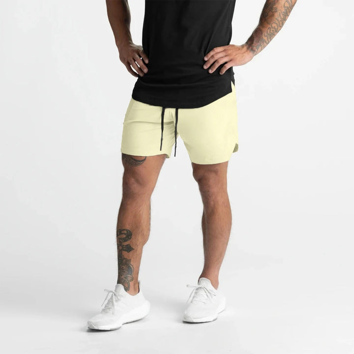 Herre hurtigttørrende sportsshorts, let ensfarvet design, elastisk linning, perfekt til træning.