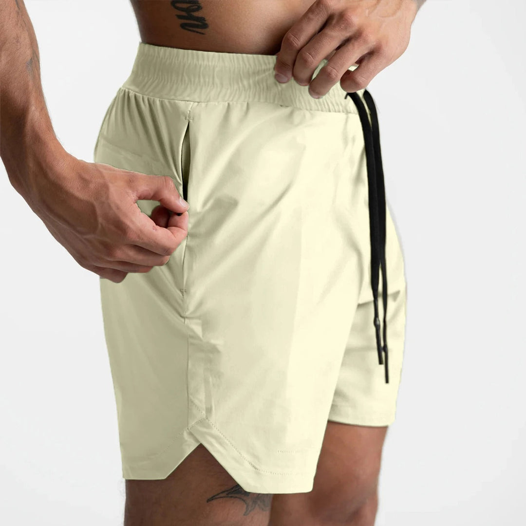 Herre hurtigttørrende sportsshorts, let ensfarvet design, elastisk linning, perfekt til træning.