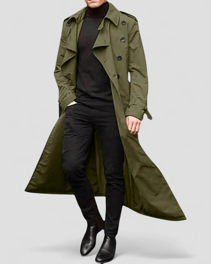 Mænds lang dobbeltspændt trenchcoat i blå, vandtæt med en stilfuld silhuet. Velegnet til efterår og vinter.