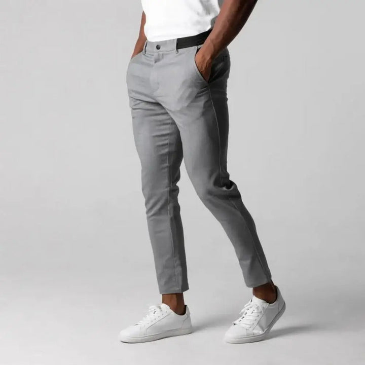 "Miesten slim-fit business-housut, joustava vyötärö, harmaa, elegantti siluetti, moderni muotoilu, monipuolinen yksivärisyys"