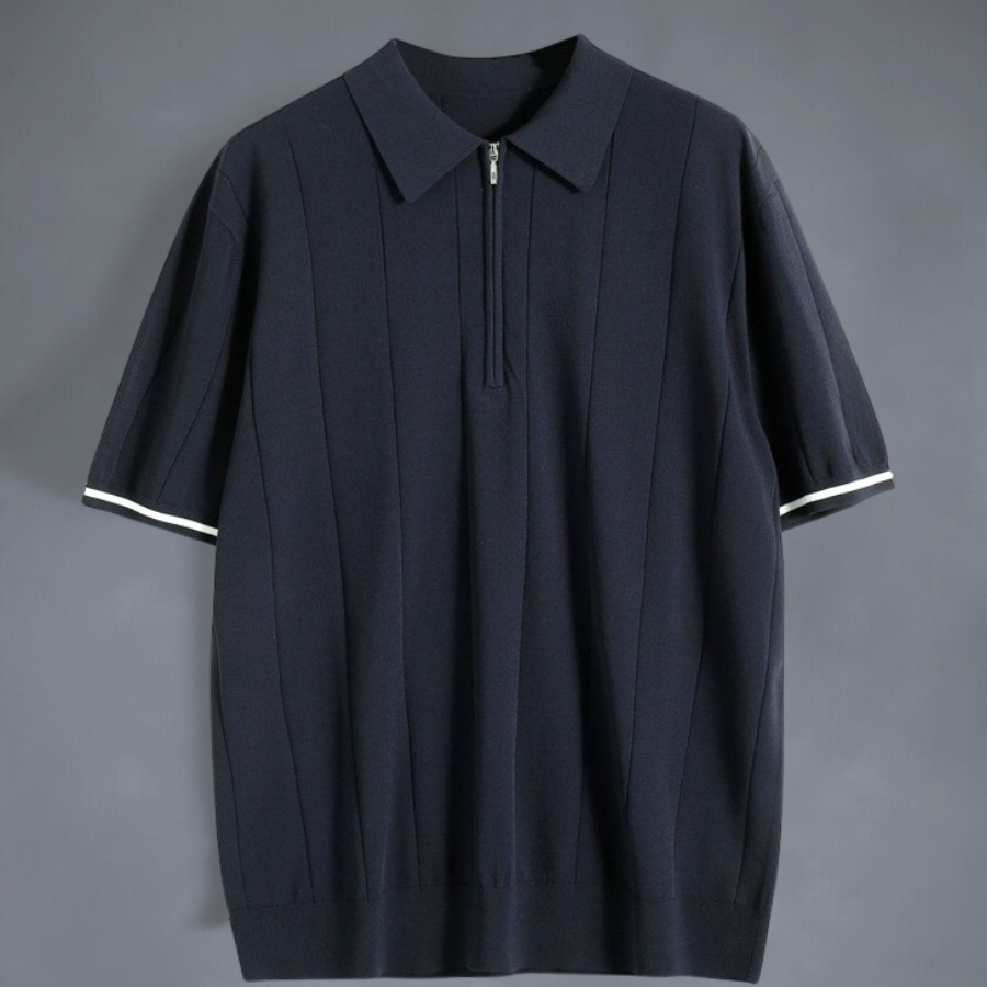 Miesten tummansininen ja valkoinen puuvillainen polo, pehmeä materiaali, tyylikäs ilme, neljännesvetoketju.