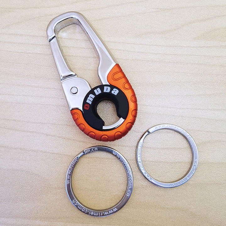 Mænds stilfulde nøglering i rustfrit stål, orange og blå, elegant og holdbar nøgleopbevaringsløsning.