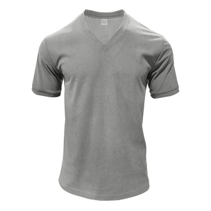 "Miesten vakosamettinen slim fit V-kaula-t-paita, pehmeä vakosamettikangas, tyylikäs muotoilu, lyhythihainen malli."