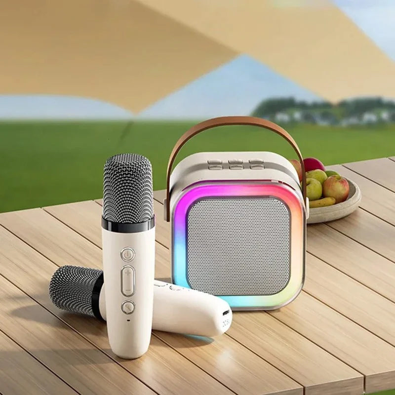 Mini karaokemaskine, trådløse mikrofoner, elegant design, flerfarvet, perfekt til musikelskere og fester.