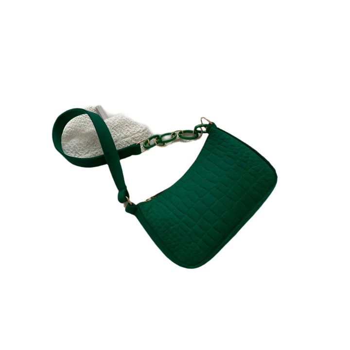 Minimalistisk dame skuldertaske, halvmåneformet top, firkantet bund, grå, kort skulderrem, stilfuld.