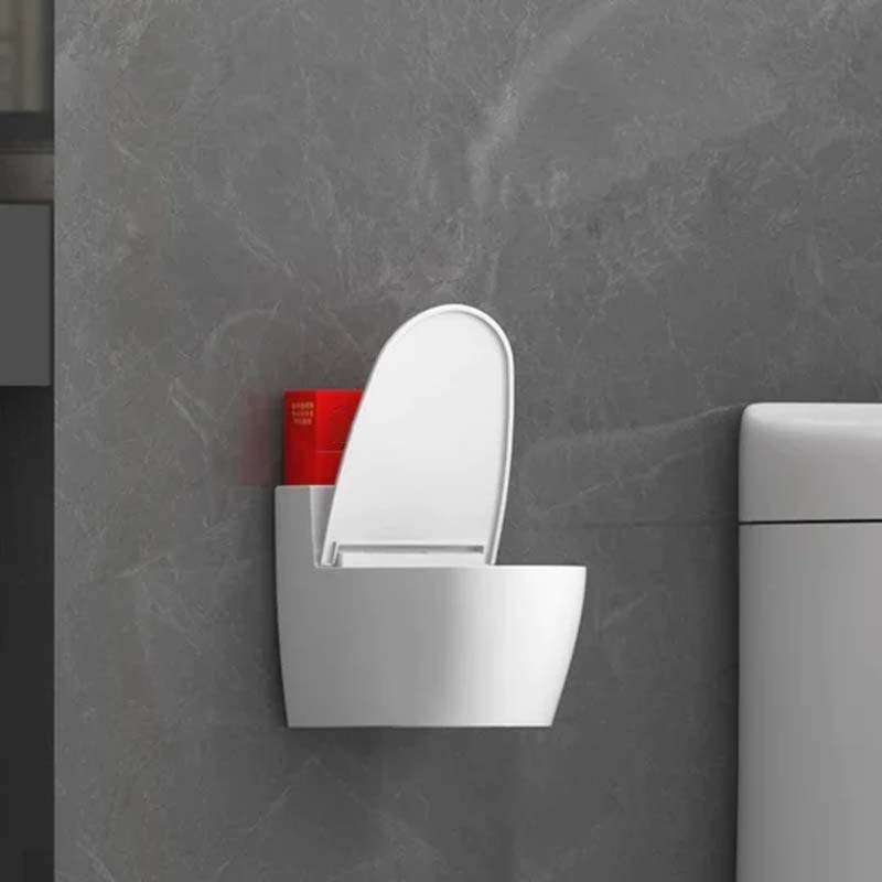 Moderne sølv-guld-hvid toilet askebæger, der ligner et miniaturetoilet, lavet af holdbart ABS-plast.