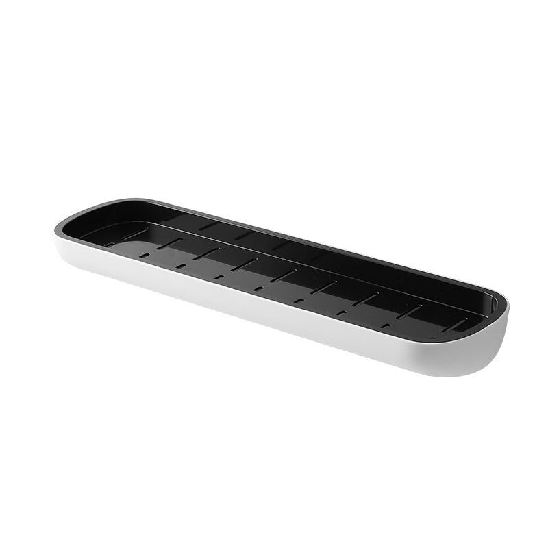 Multifunktionel klæbehyllede organizer i sort, holdbart PET-materiale, åbent design med drænhuller.