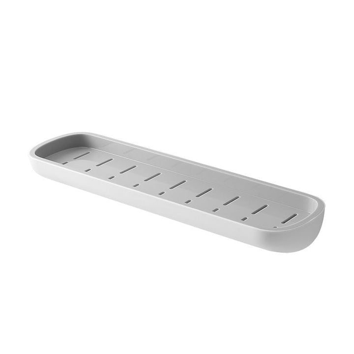 Multifunktionel klæbehyllede organizer i sort, holdbart PET-materiale, åbent design med drænhuller.