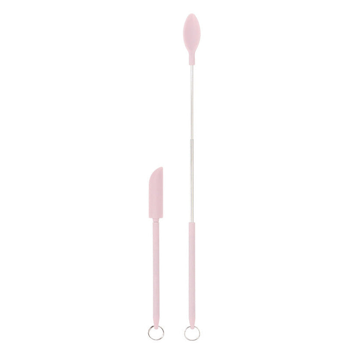 Alsidig, rød silikone teleskopspatel med justerbar stang er ideel til høje krukker.