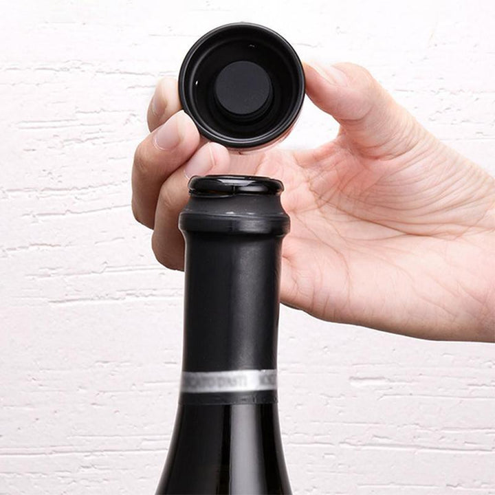 Multifunktionel rød vinflaskeprop med rundt design, bevarer drikkevares friskhed ved tæt forsegling.