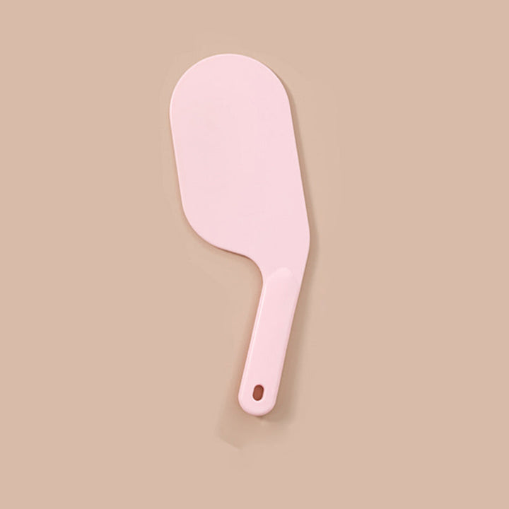 Multifunktionelt sengeværktøj i lys rød, hvid og grå med ergonomisk design til nem sengetid.