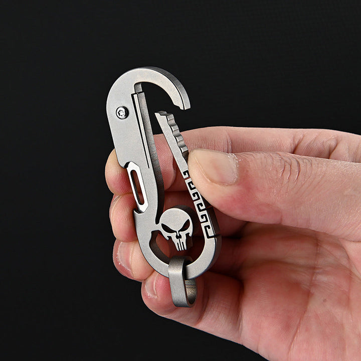 Multifunktionel titan kniv nøglering, moderne design, mørkegrå metal, nem at bære til hverdagsbrug.