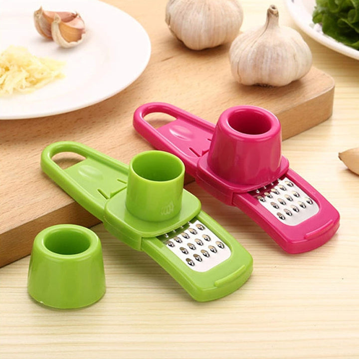 Multifunktionel hvidløgshakker med håndbeskytter, grøn-rød, skarp klinge, sikker skæring i køkkenet