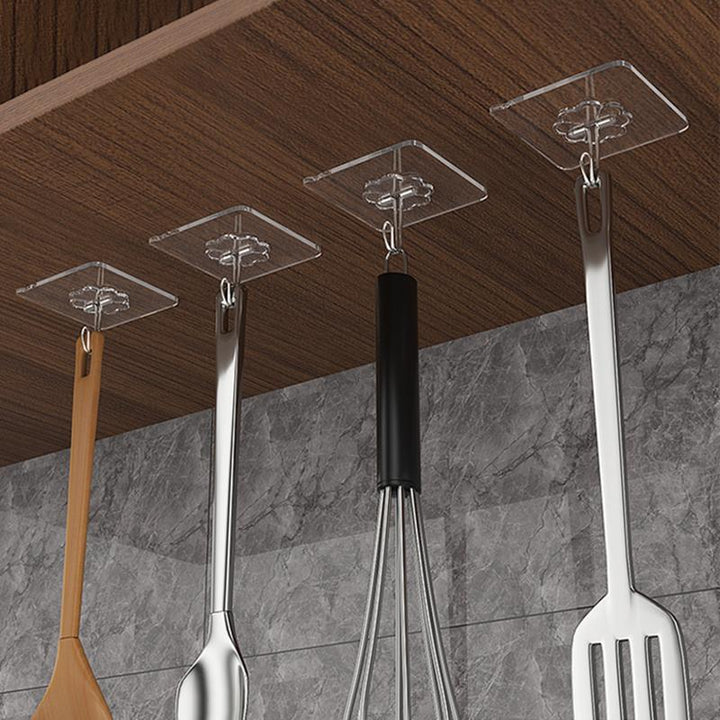 Multifunktionelle klare klæbekroge, minimalistisk design, velegnet til ophængning af køkkenredskaber og tøj.