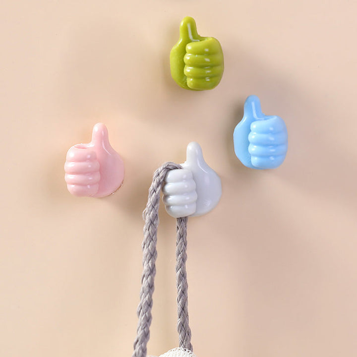 Multifarvede selvklæbende kabelholdere til glatte overflader, kompakte 2x2 cm, farver: grøn, grå, pink, blå.