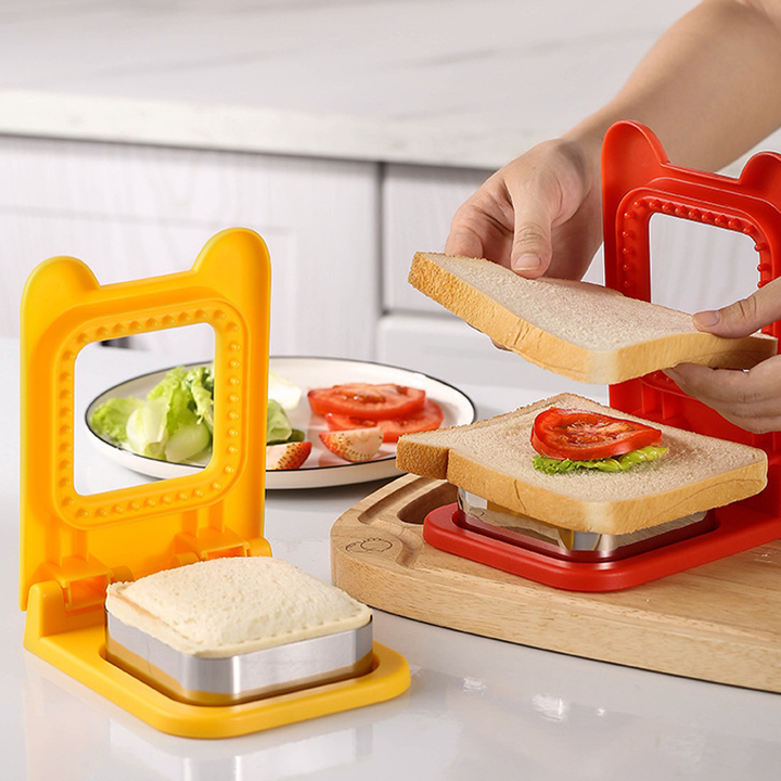 Multifarvet sandwich-forme og lukker i rød, gul og grøn til køkkenbrug.