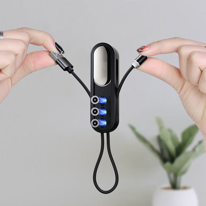 Musta 3-in-1 magneettinen latauskaapeli, kompaktin kokoinen, vaihdettavat liitännät iPhone, Android, Type-C laitteille.