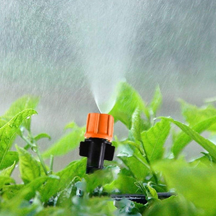 Sort og orange justerbar dryp-sprinkler til haven, præcis vanding, lavet af POM-plast, vandbesparende til haven.