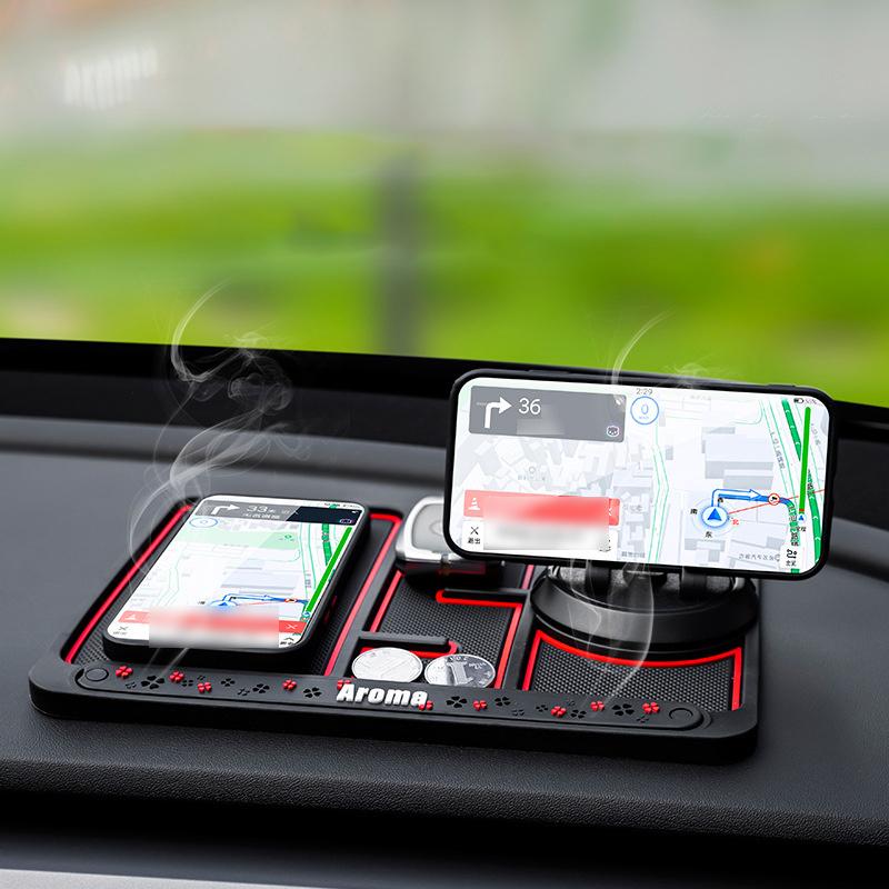 Mobilholder til bil i sort og rød, lavet af PVC med skridsikker måtte, 360-graders rotation og aromaterapi-funktion.