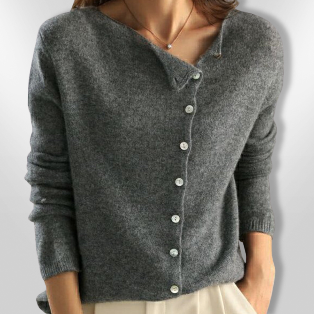 Dame åben cardigan i en blød, beige farve med et åbent snit og lange ærmer, perfekt til afslappet og festlig brug.