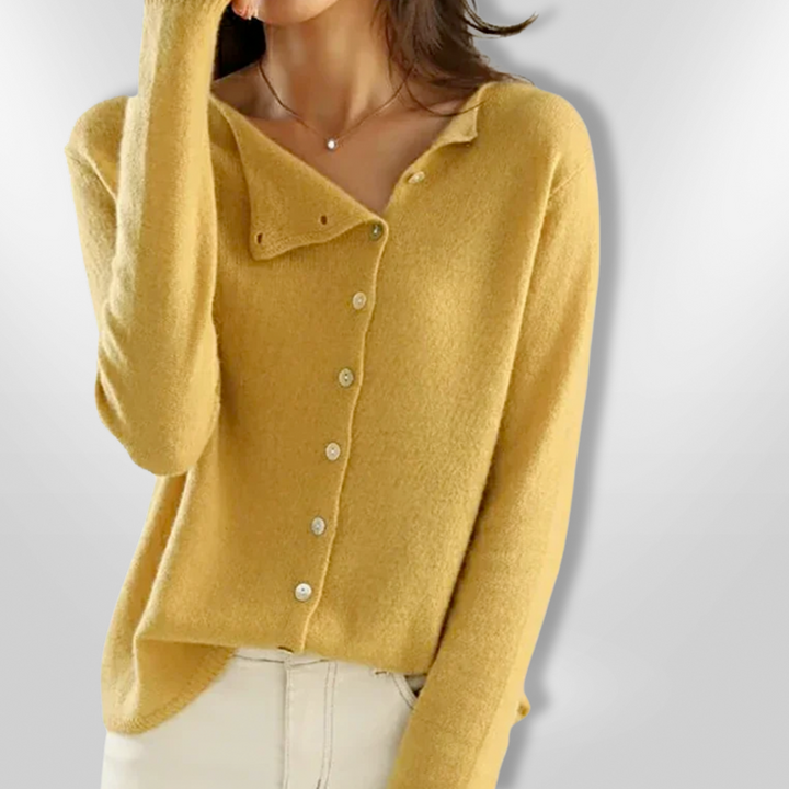 Dame åben cardigan i en blød, beige farve med et åbent snit og lange ærmer, perfekt til afslappet og festlig brug.