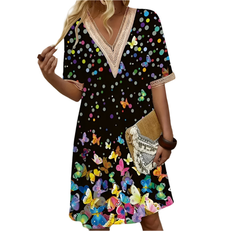 Dame printet V-hals sommerkjole med let stof, levende print, perfekt til afslappede sommerlejligheder.