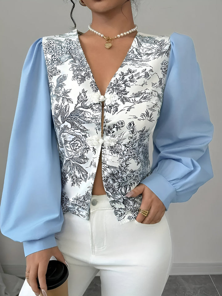 Damebluse med V-hals og blomstertryk, lanterneærmer: farverigt blomstermønster, moderne og elegant look, til kvinder til hverdag og fest.