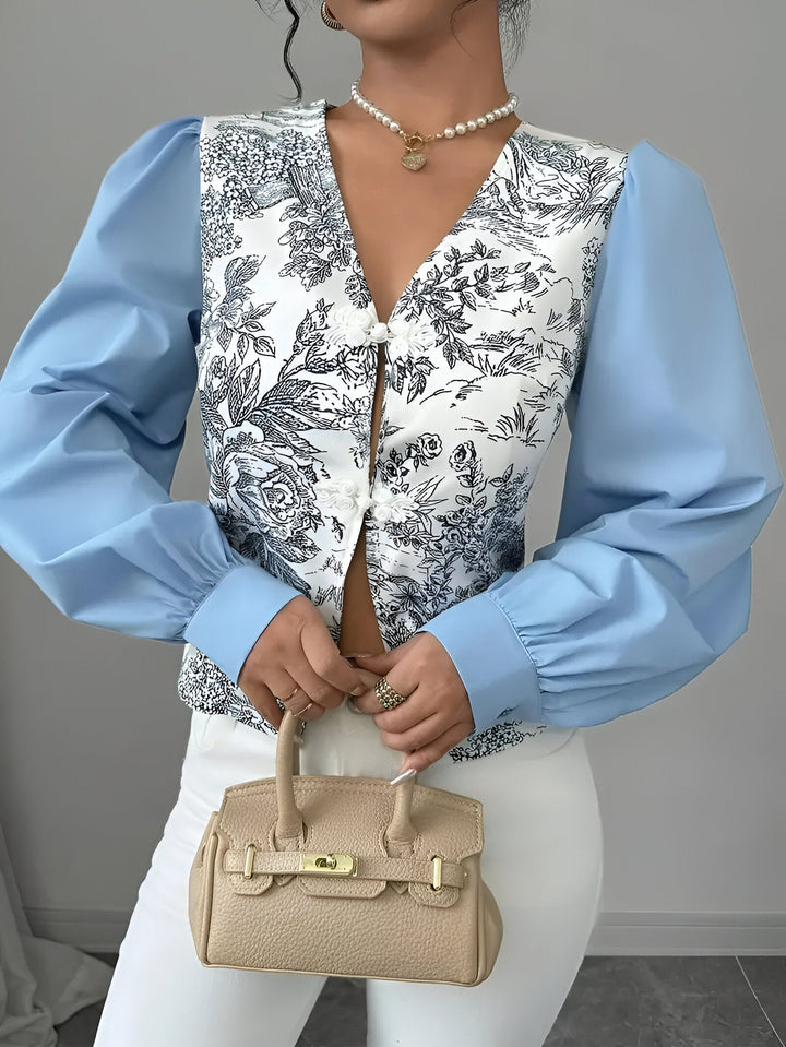 Damebluse med V-hals og blomstertryk, lanterneærmer: farverigt blomstermønster, moderne og elegant look, til kvinder til hverdag og fest.