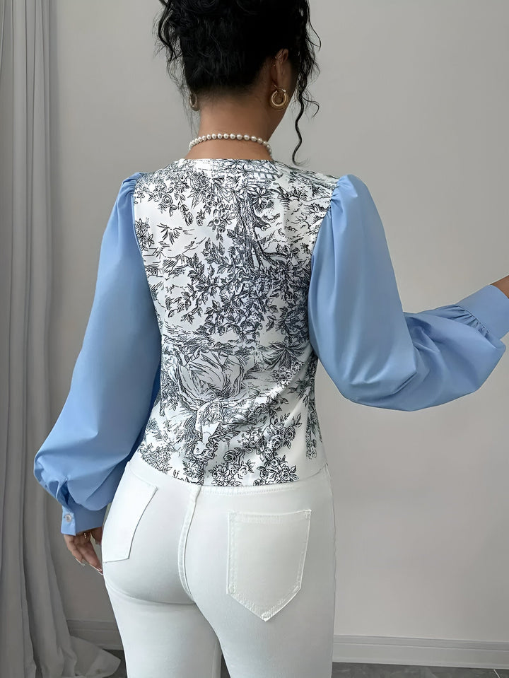 Damebluse med V-hals og blomstertryk, lanterneærmer: farverigt blomstermønster, moderne og elegant look, til kvinder til hverdag og fest.