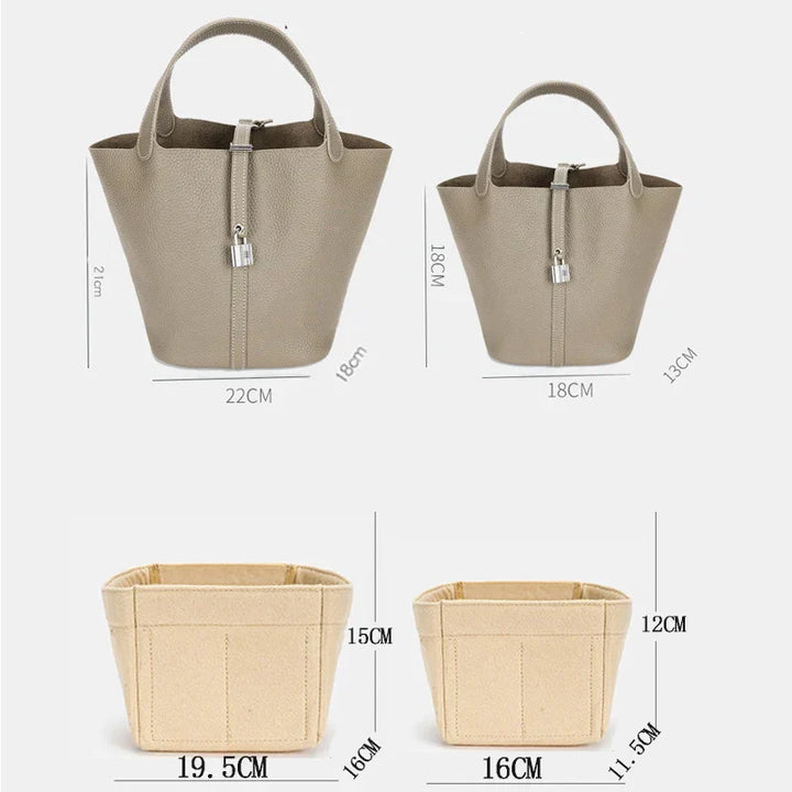 Damehåndtaske i beige med organiseret interiør, lavet af kunstlæder, elegant og rummelig, forsidevisning, stilfuldt look.