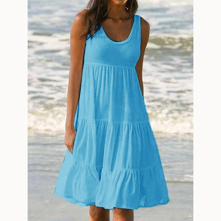 Dame boho-stil sommerkjole med flæse, pink, mønstret, luftig og let, perfekt til solrige dage.