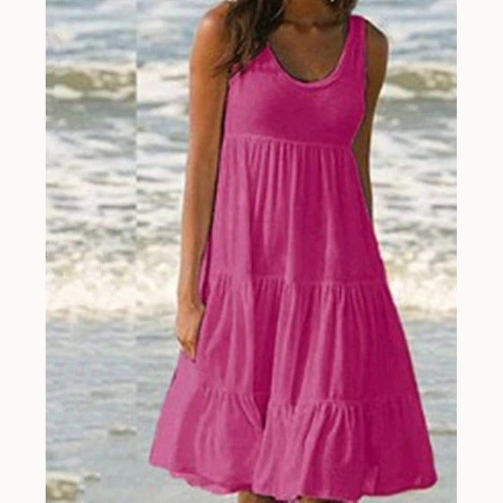 Dame boho-stil sommerkjole med flæse, pink, mønstret, luftig og let, perfekt til solrige dage.