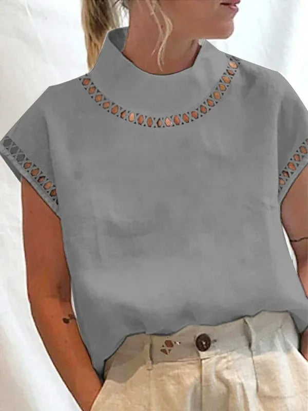 Dame elegant top i grå med stilfulde detaljer