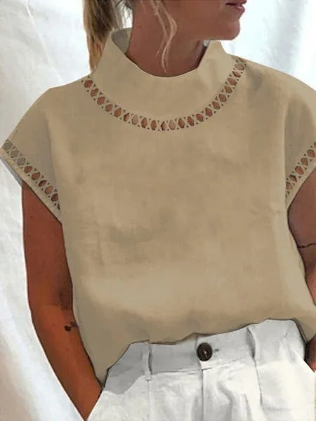 Dame elegant top i sort med stilfulde detaljer