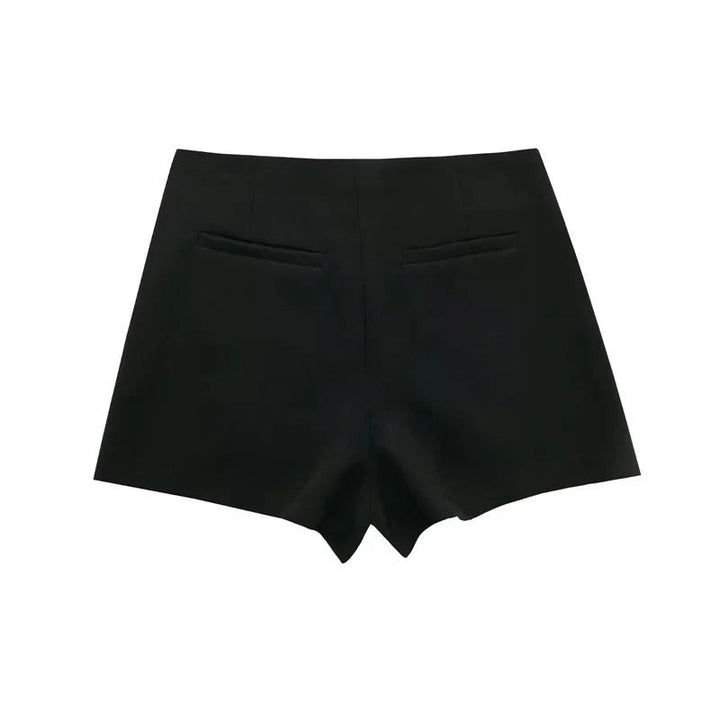 Dame asymmetrisk skort med høj talje og åndbarhed, der kombinerer shorts' praktiske anvendelighed og nederdelens elegance.